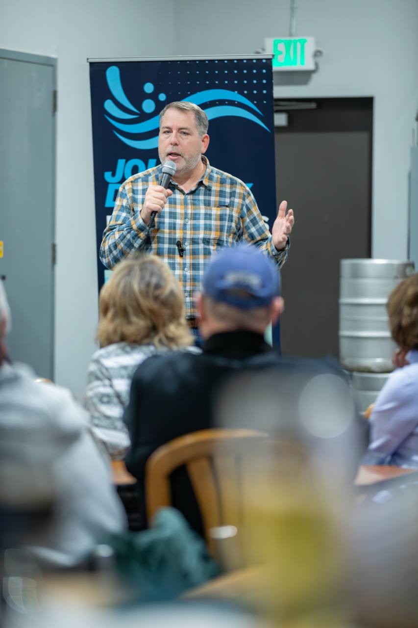 John making a point to the audience